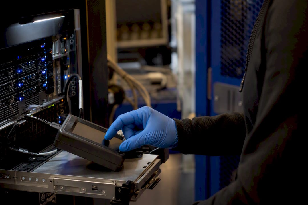 Hand placing diagnostic device near server module
